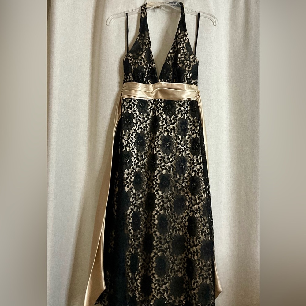 Black Lace backless dress.  size 6 Gold underlay. Like New.  Knee Length